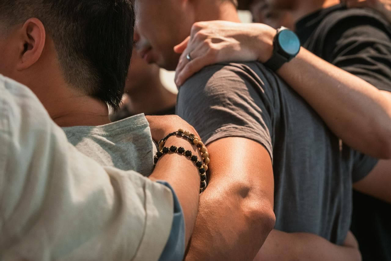 Arms around shoulders at a Proud Asian Men retreat